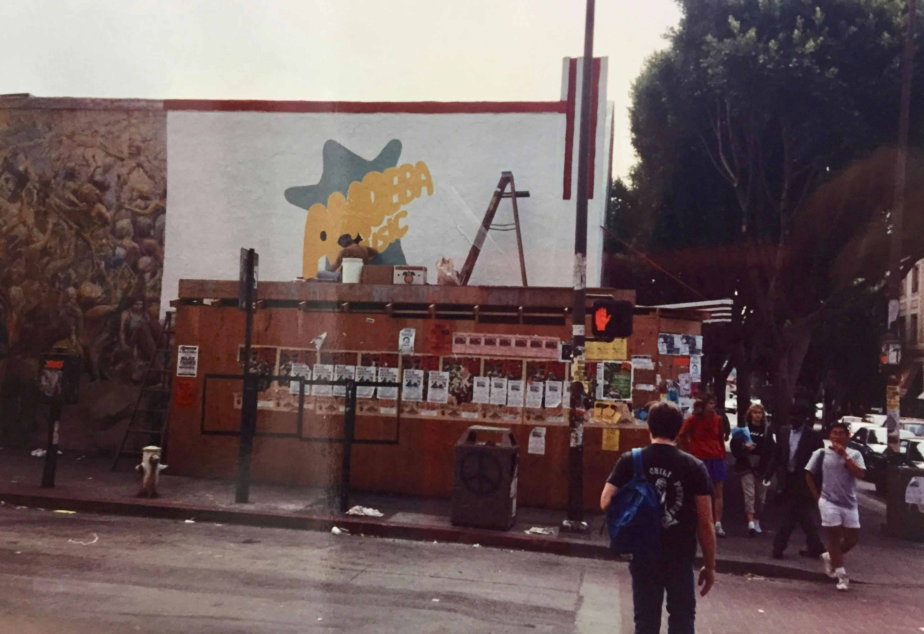 Painting the Amoeba logo on the Berkeley store, September 1990.